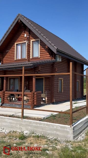 Окна Bautex в цвете темный дуб в массе установленные в деревянном доме. ОКНАЛЮКС Севастополь