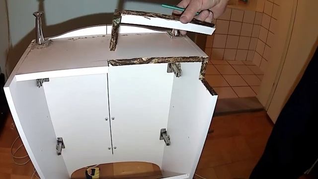 Установка (подгонка к стене) тумбы с раковиной.