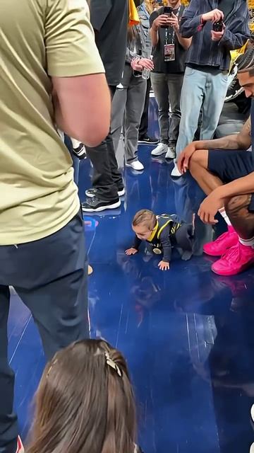 Obi with his son, Oziah, ahead of Game 6