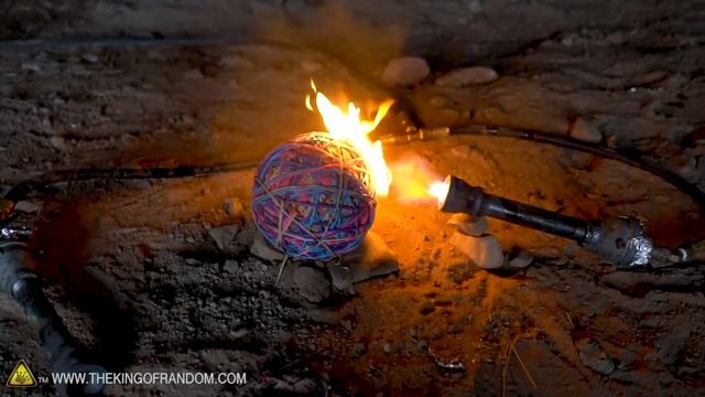 Snapping a GIANT Rubber Band Ball