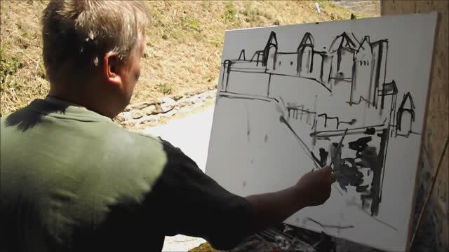 Художник Федор Помелов пишет замок в городе Каркассон на юге Франции, июнь 2012г.