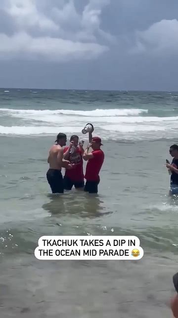 Matthew Tkachuk Jumps In The Ocean Mid-Parade