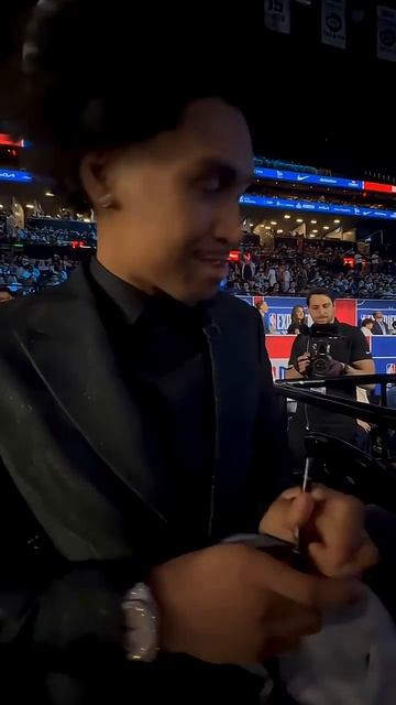Dylan Harper signs his first autograph as an NBA player