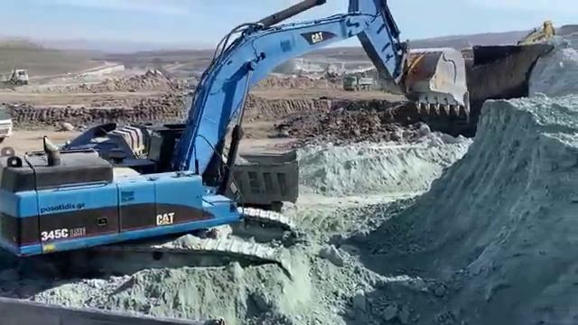 Caterpillar 345C Excavator Loading Trucks