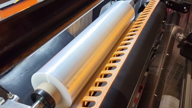 Rewinding machine for Nano stretch film with double-edge