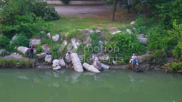 33696435_MotionElements_view-of-fishermen-near-the-river-fishing_preview