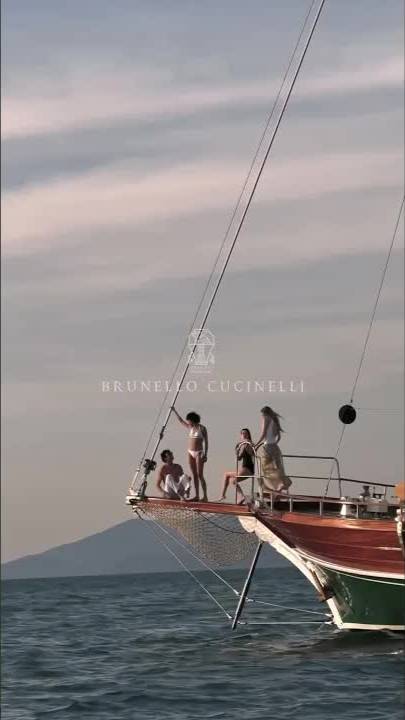 The sun’s touch lingers as lightweight fabrics move softly in the warm summer air.