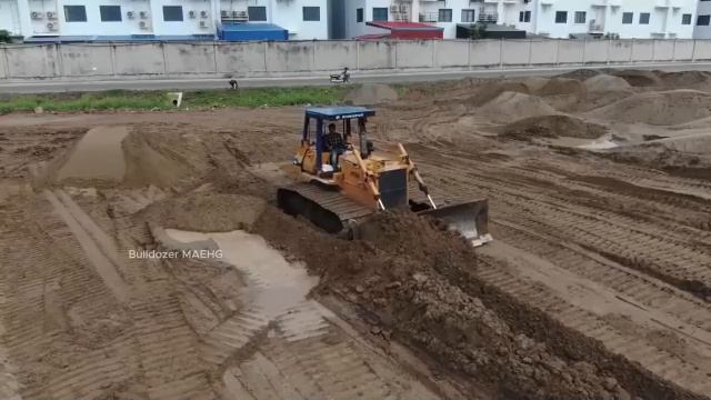 Бульдозер Грузовиком, перевозят Камень, заполняя Землю