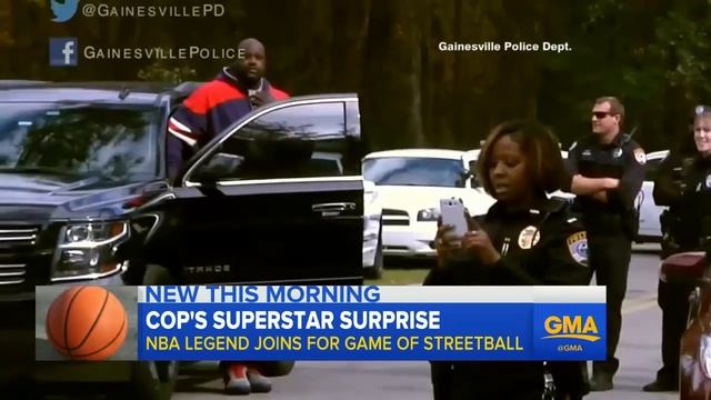 Police officer plays football with teens
