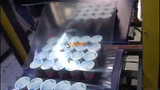 Машина для упаковки молочных продуктов ( кефир, молоко) в термоусадочную пленку