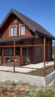 Окна в цвете темный дуб в массе установленные в деревянном доме. ОКНАЛЮКС Севастополь