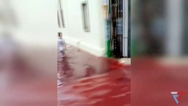 Village submerged by red water after flood hits batik factory