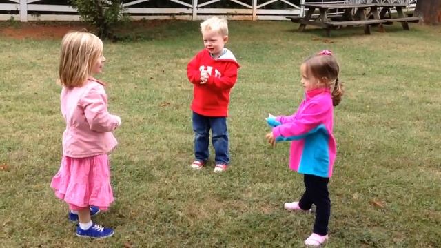 Preschool kids playing tag