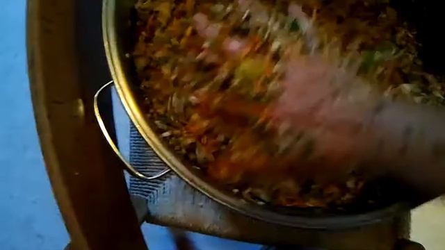 Mixing a batch of chop to feed to parrots