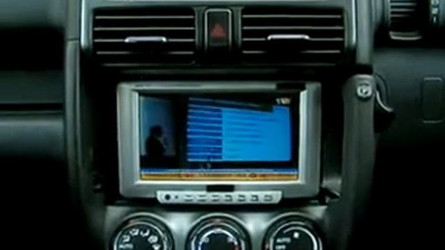 Watching TV news inside Honda CRV