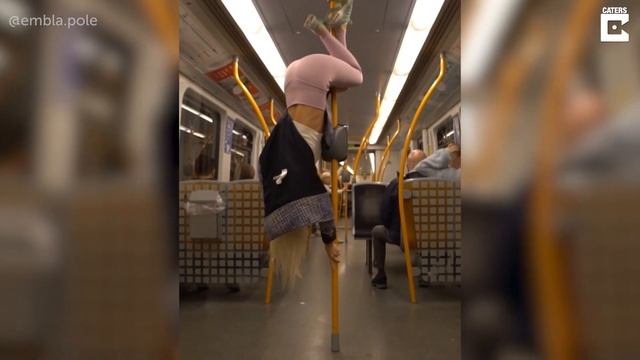 WOMAN POLE DANCES WHILST RIDING THE SUBWAY