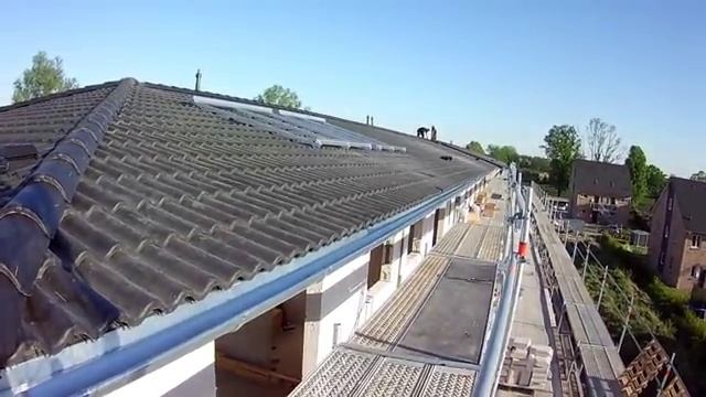 Кровля из черепицы. Почти футбольное поле из бетона.