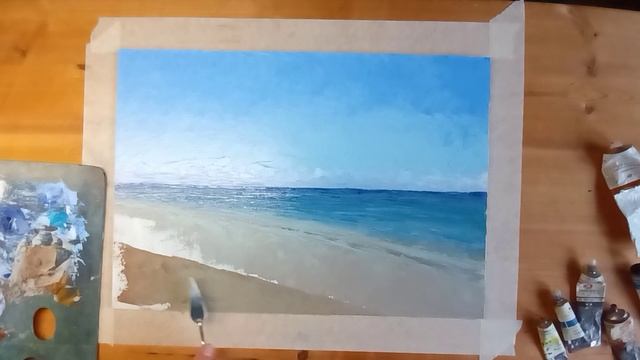 Красивое видео, как художник мастихином и масляными красками пишет море.