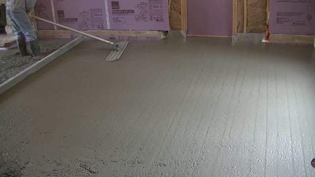 3 Men Pouring An Interior Concrete Floor Over Existing Concrete (Radiant Heat Floor)