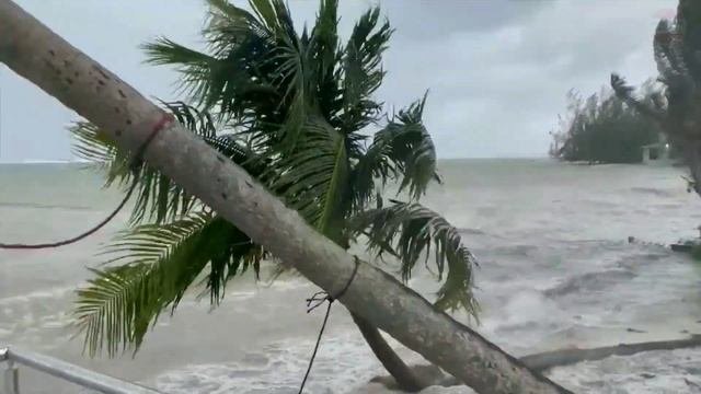 Hurricane Ian with strong wind hit Cayman islands causing streets flooded