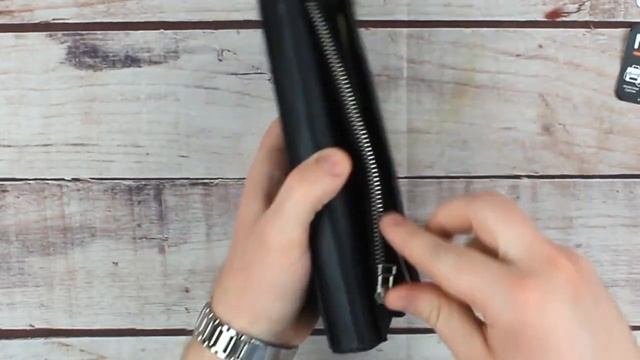 Мужской кошелек-клатч вертикальный черный из натуральной кожи с отделением для телефона Grande Pell