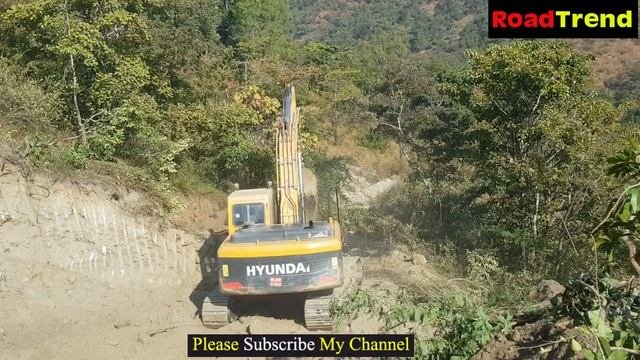Hyundai Excavator making road in the middle of thick forest