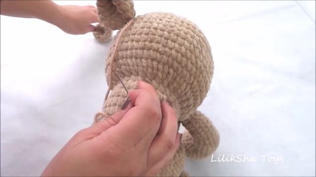 How to sew the ears onto the head of Amigurumi Teddy Bear.