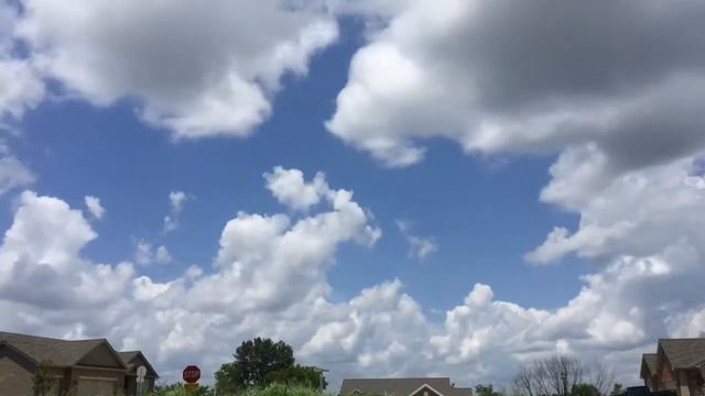 July 3, 2019 white fluffy clouds trying to break the cap