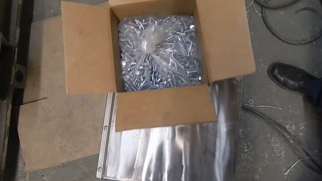 Vibratory Packer to Settle Plastic Bottle Lids in Boxes - Cleveland Vibrator Co.