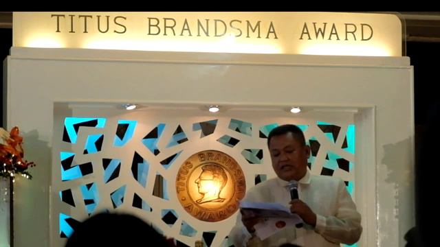 Kodao's Villanueva accepts Titus Brands Award