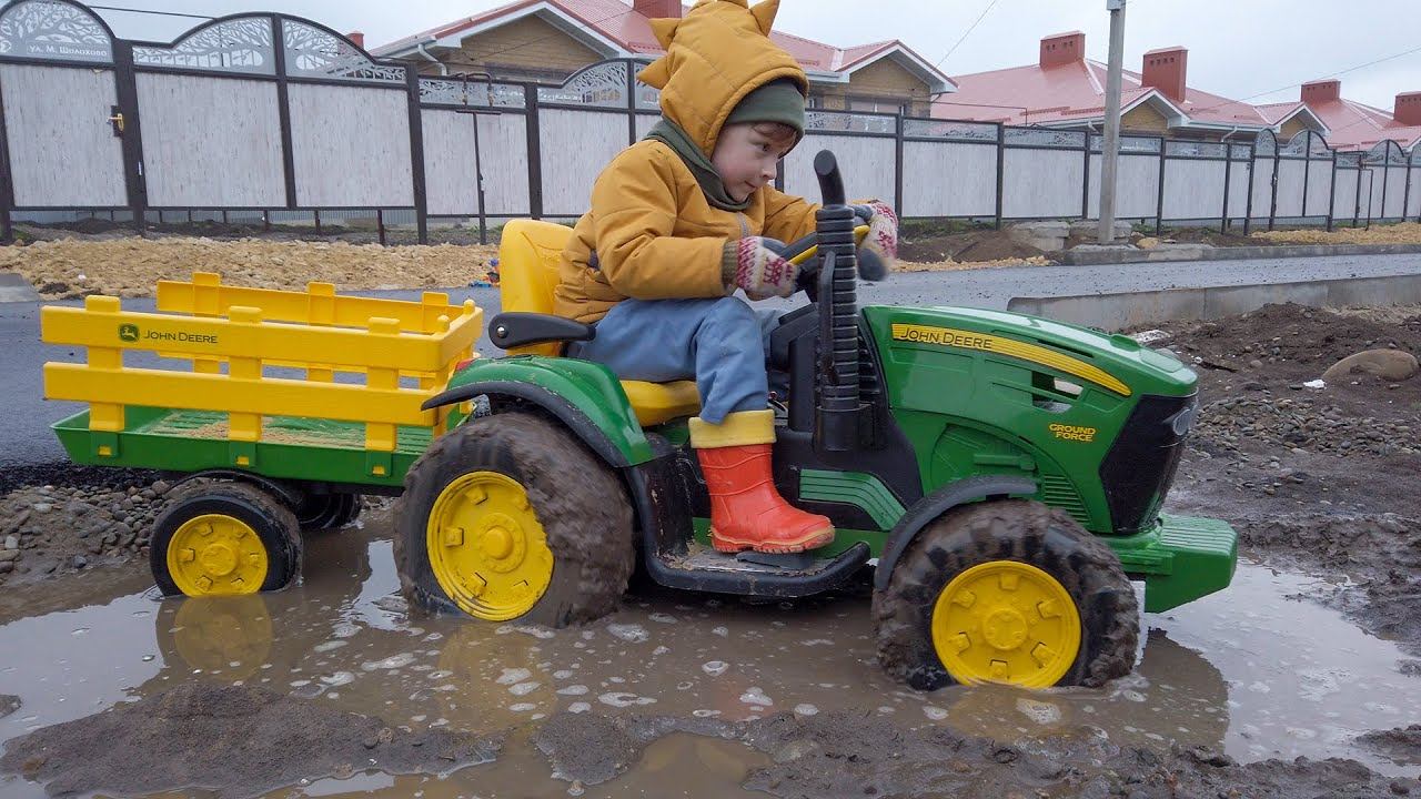 Leo got stuck in the mud on a tractor, dad came to the rescue. Tractor in the mud for children.