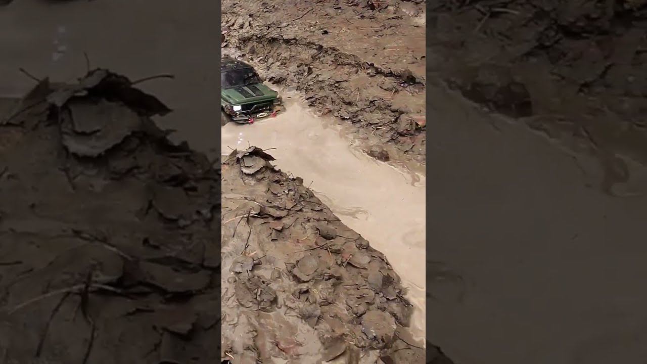 Cherokee and Land Cruiser in the mud