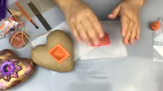 Learn how to make an altered heart with a shadowbox like window out of a paper mache heart