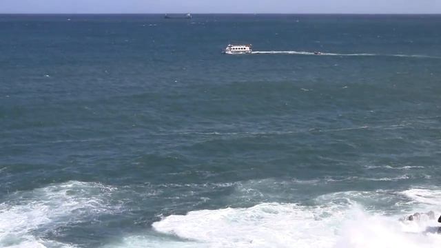 Santander Spain 26 08 11. The sound of a slightly stormy Pacific Ocean.. Rocks