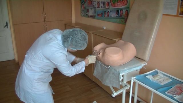 Осмотр шейки матки в зеркалах у беременной женщины