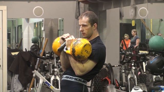 Denis Vasiliev explains how to lock the handles of the kettlebells in the rack position