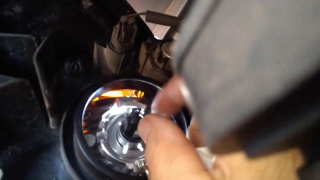 How to replace the headlight bulb on a  Mitsubichi Mirage