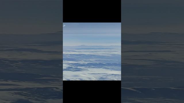 Вид на гору АРАРАТ (на горизонте) и Кавказские горы из окна самолёта