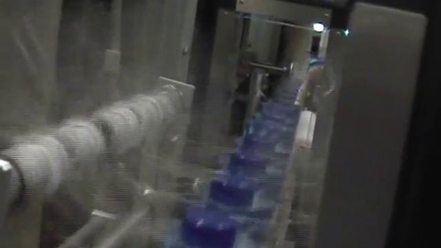 Этикетировочная машина  на "слив" этикетку