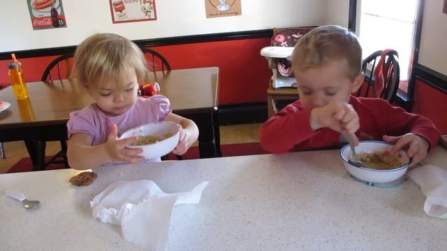 1 minute video of two kids eating soup