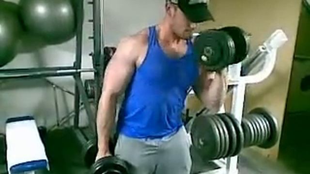 Curl De Biceps De Pie Con Mancuernas De 27'5 Kg