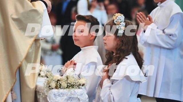 Lida, Belarus - May 31, 2022: Children going to the first holy communion.