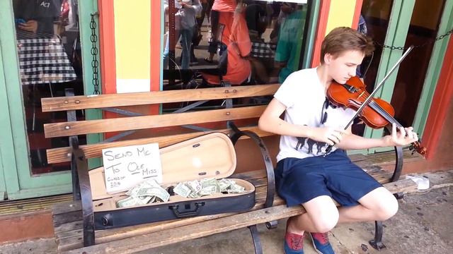 Young man plays Violin to earn money for college