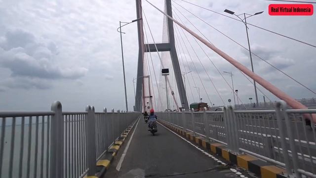 1# Riding a motorcycle across Suramadu, Indonesia’s longest bridge, Surabaya, East Java, Indonesia