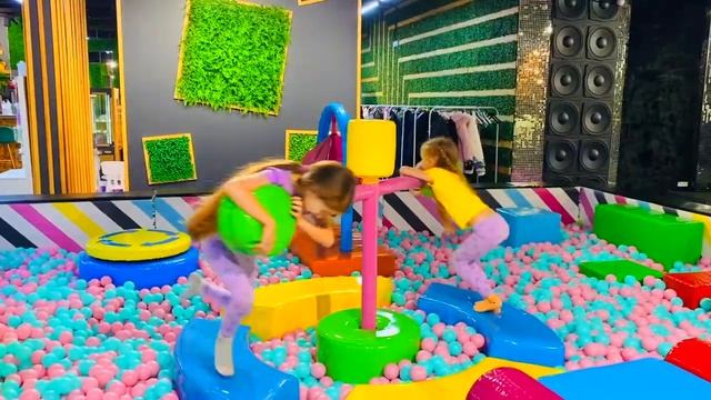 Polina and Dasha play at the learning center for Children