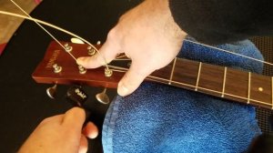 How To Restring An Acoustic Guitar Properly