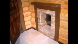 Баня из рубленного бревна с полукруглой крышей