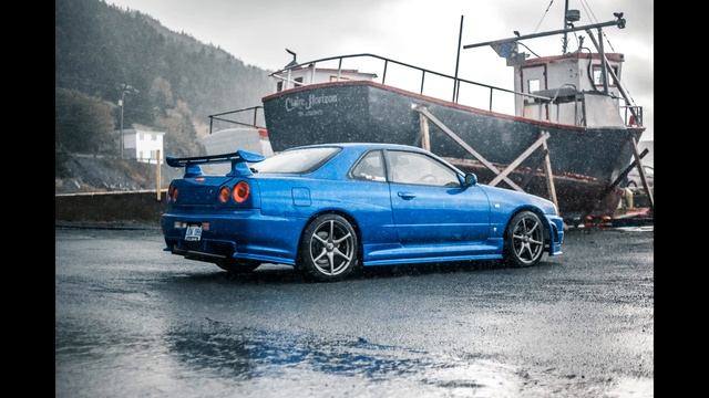 Vehicles traffic busy wet roads rain below rooftop tower block drips concrt смотреть онлайн