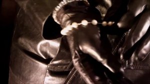 Woman in Black Leather Trench Coat and Leather Gloves