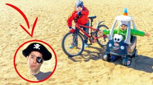 Pirate stuck in the sand. Toy Police Car and bike racing.